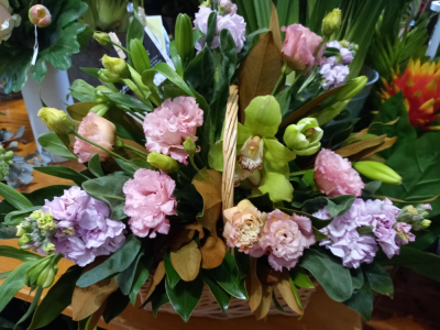Mixed Basket - Basket of mixed blooms perfumed by stocks and accompanied by cymbidium orchids, lissianthus, lillies and magnolia leaf