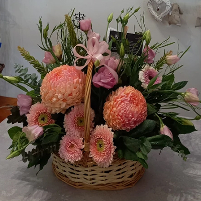Apricot basket - Gorgeous apricot and pink tones  featuring pom pom Chrysanthemums, gerberas, snapdragons & lissianthus in a basket