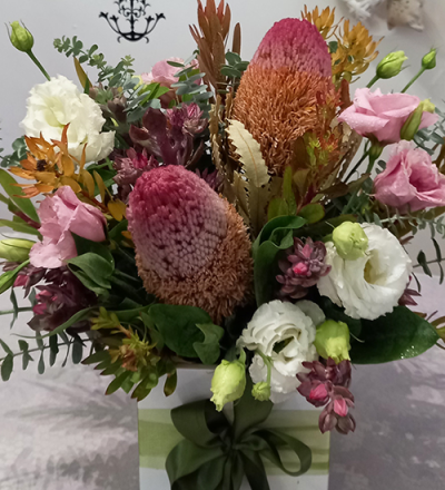 All For You - A stunning container arrangement, created using the fresh blooms of the day in a mix of colours with complementary foliage.